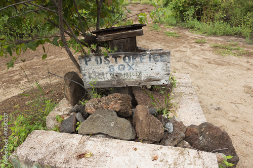 Post Office Box sign on Floreana Island, Selective focus on the sign, background is out of focus.