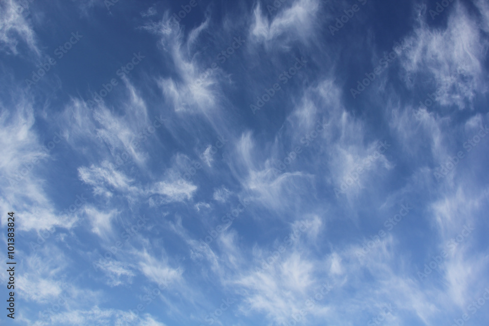 Cloudscape of cirrus uncinus clouds in blue sky