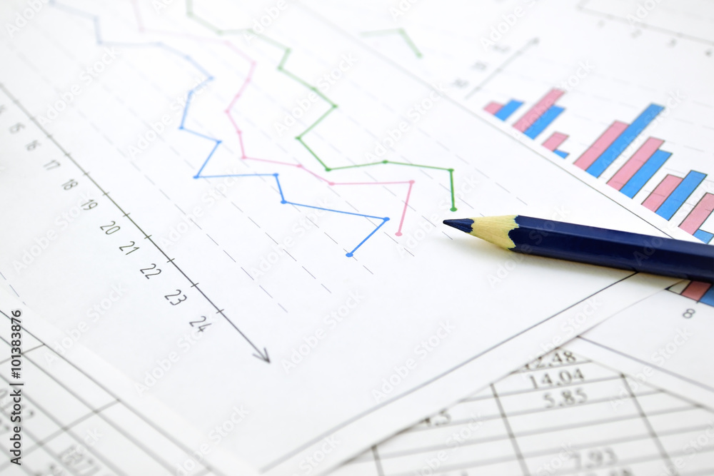 Photo diagrams graphs and numerals in the table on the paper Photo diagrams graphs and numerals in the table on the paper