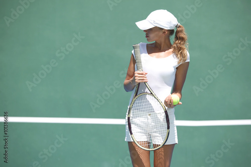 Woman on tennis court © yellowj