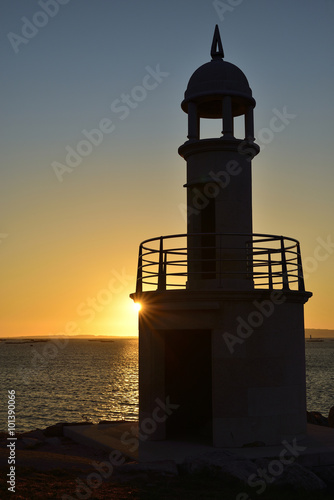 backlit lighthouse in sunset of the Rias Baixas