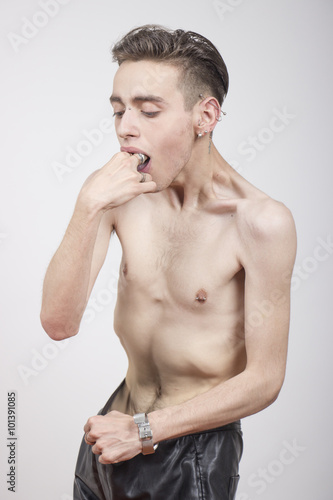 Young man with anorexia nervosa and Bulimia nervosa problem. photo