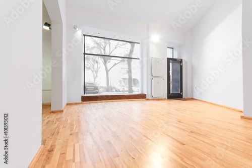 empty room newly renovated - store   shop with wooden floor and