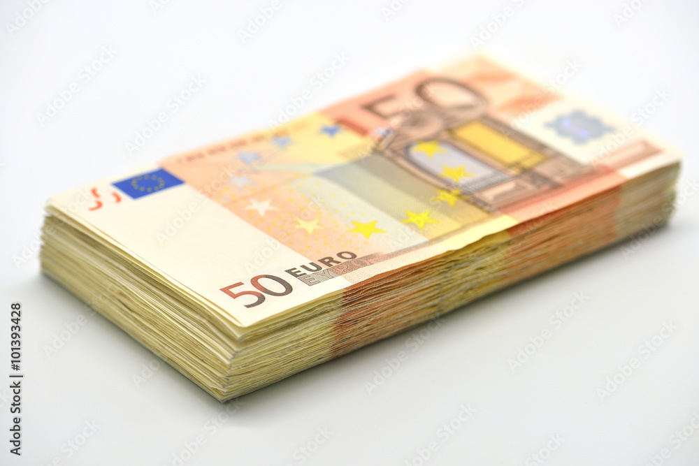 Money pile of 50 Euro banknotes isolated in white Money pile of 50 Euro banknotes isolated in white
