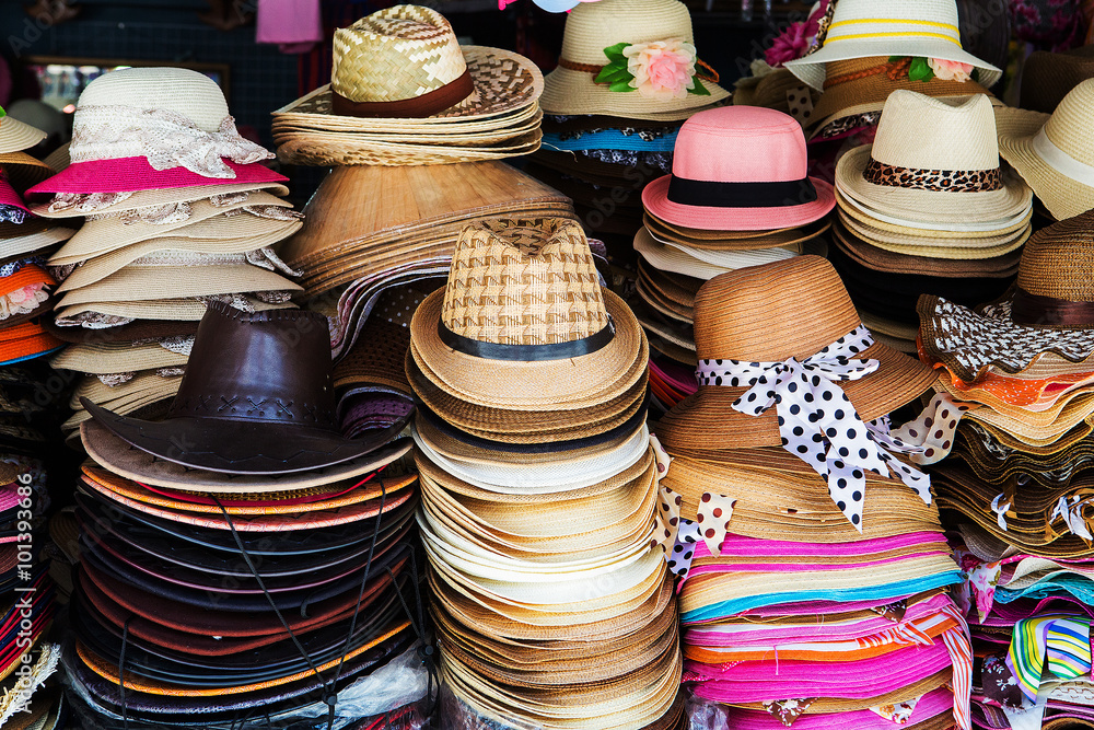 A lot of hats lie on the table