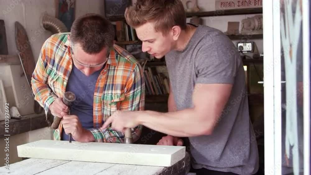 Stone Mason With Apprentice Working Shot On RED Camera Stone Mason With Apprentice Working Shot On RED Camera