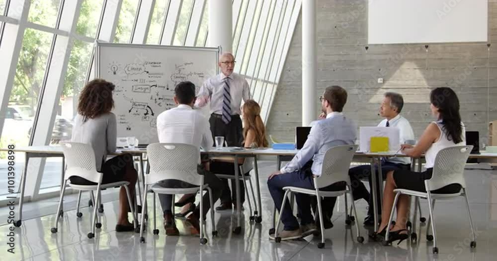 Businessman Leads Brainstorming Session Shot On R3D Businessman Leads Brainstorming Session Shot On R3D