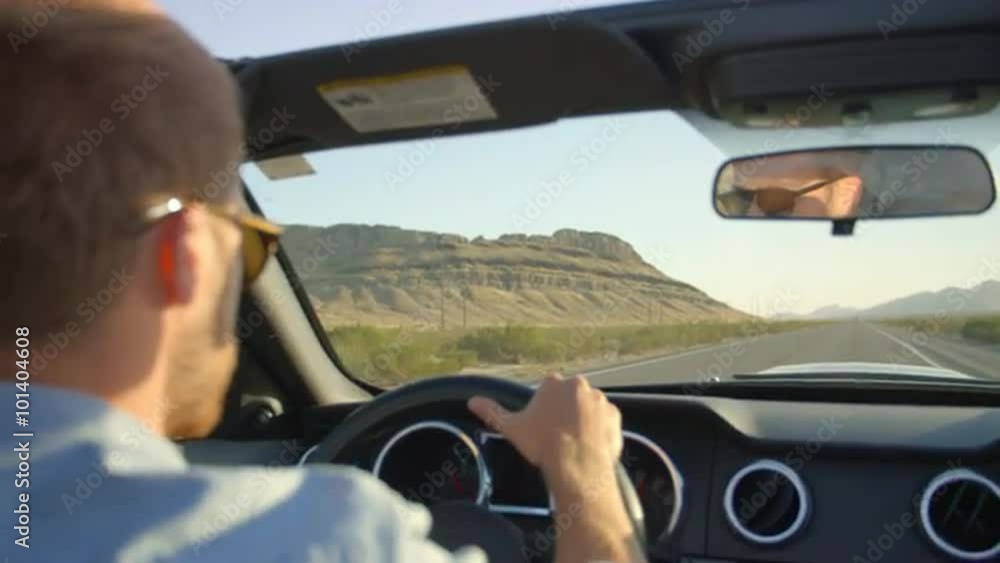 Man In Convertible Car Driving Along Open Road Shot On R3D Man In Convertible Car Driving Along Open Road Shot On R3D