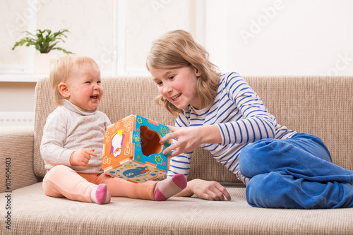 two sisters playing educational games