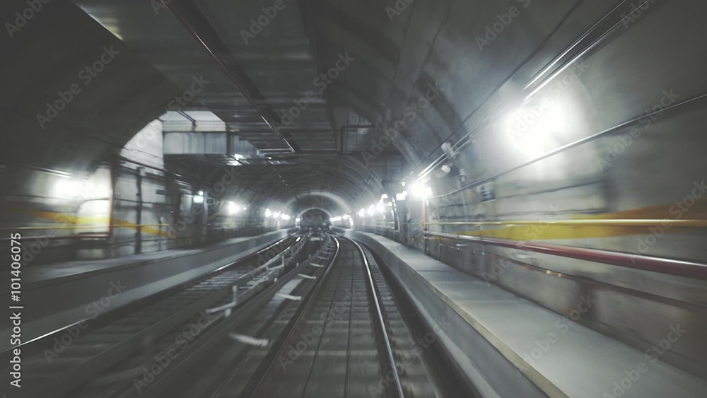 Fast ride of a train in a dark underground tunnel in the modern city Fast ride of a train in a dark underground tunnel in the modern city