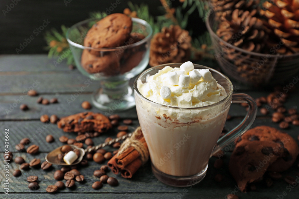 Cup of hot cacao with marshmallow and cookies on black table Cup of hot cacao with marshmallow and cookies on black table