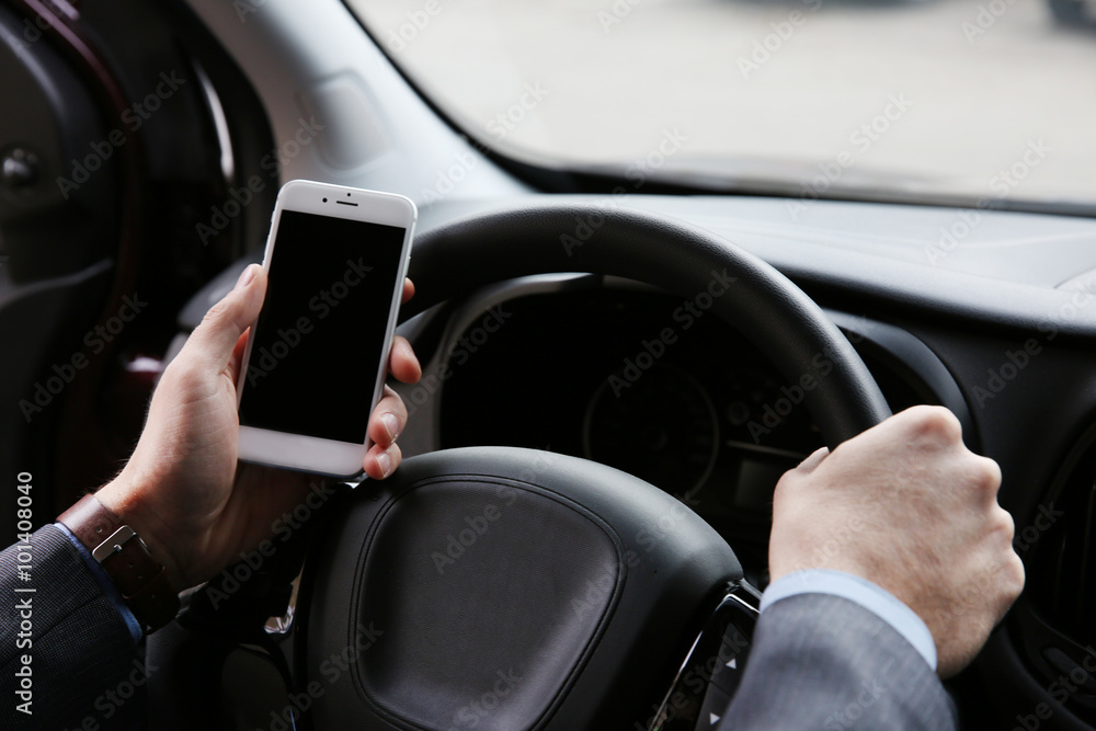 Man driver using smart phone in car Man driver using smart phone in car