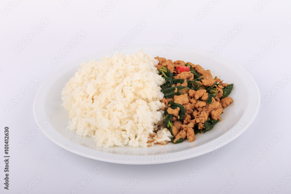 Rice topped with stir-fried chicken and basil, fried stir basil with minced chicken on white background (Isolated Background) Rice topped with stir-fried chicken and basil, fried stir basil with minced chicken on white background (Isolated Background)