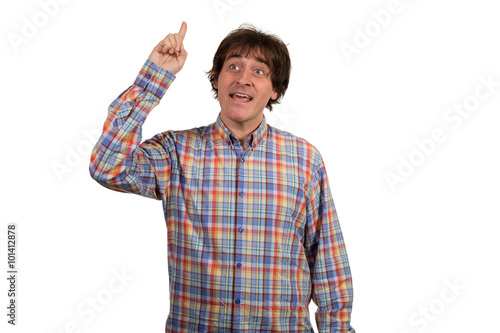 Closeup portrait of young man in checkered shirt pointing finger.