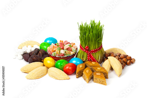 Novruz in Azerbaijan. Colored eggs for Easter and traditional sweets. Selective focus.