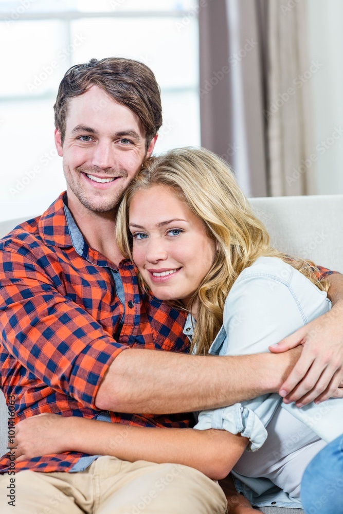 Couple hugging on the couch Couple hugging on the couch