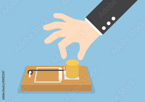 Businessman hand try to pick money from mousetrap