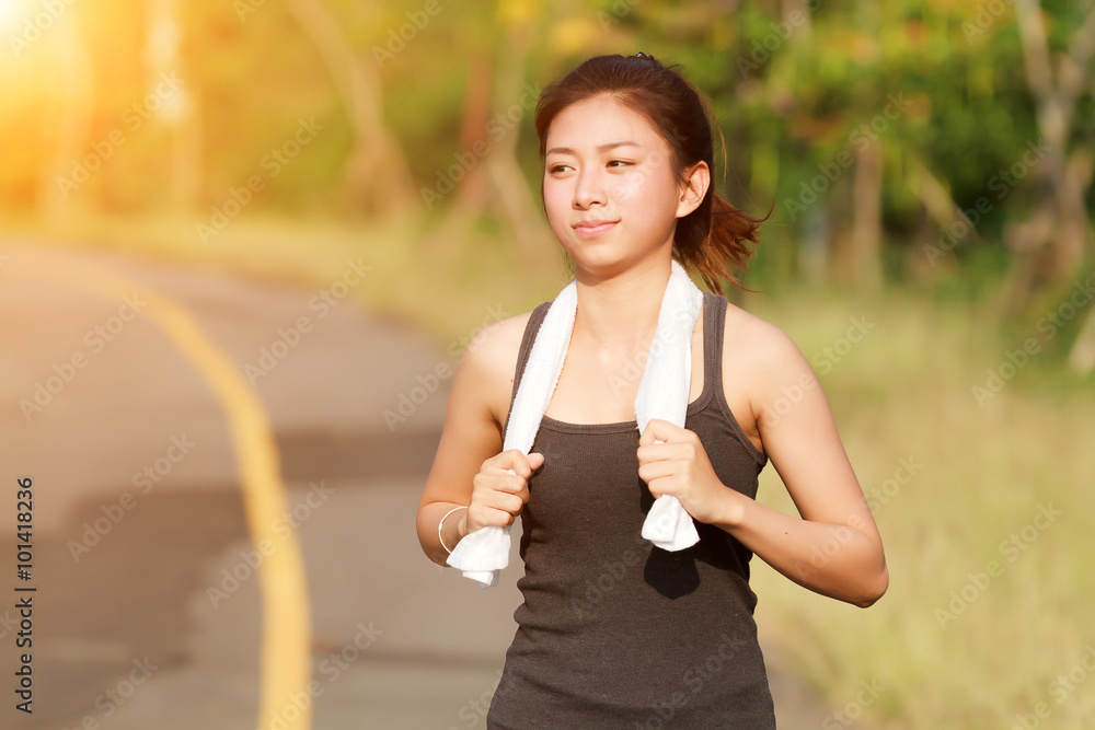 Running woman. Female runner jogging during outdoor on road .You Running woman. Female runner jogging during outdoor on road .You