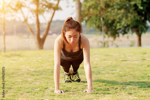 Athletic woman asia warming up and Young female athlete sitting