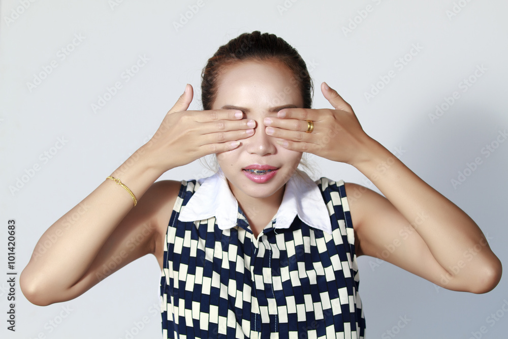 Asian woman hand Close your eyes , because I do not want to hear Asian woman hand Close your eyes , because I do not want to hear