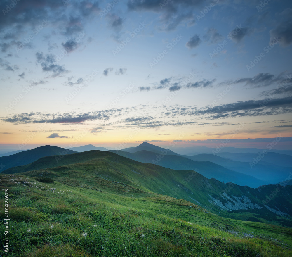 Fototapeta premium Mountain valley during sunrise. Natural summer landscape.