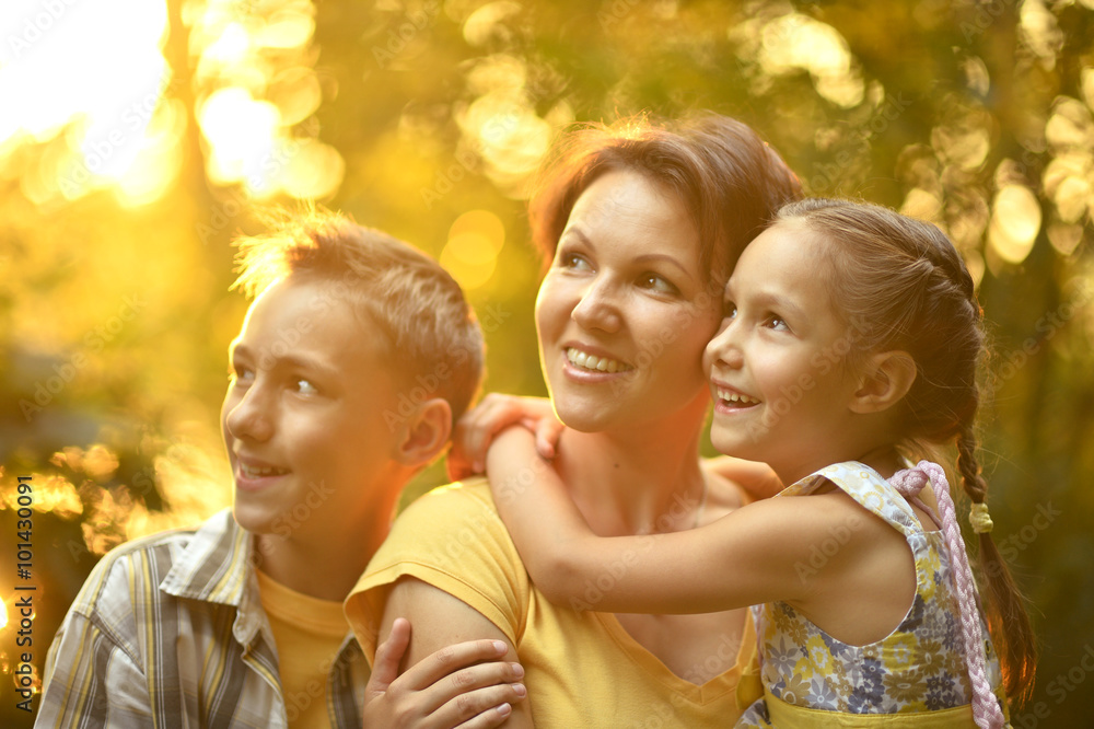 Fototapeta premium Mother with kids on the field