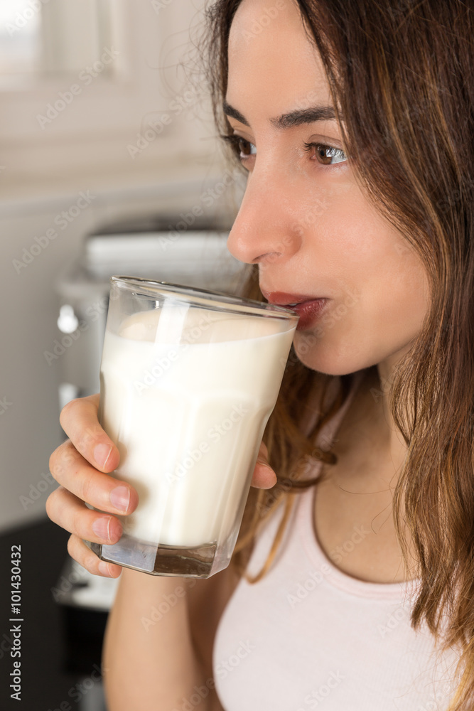 Woman having a glass of milk Woman having a glass of milk