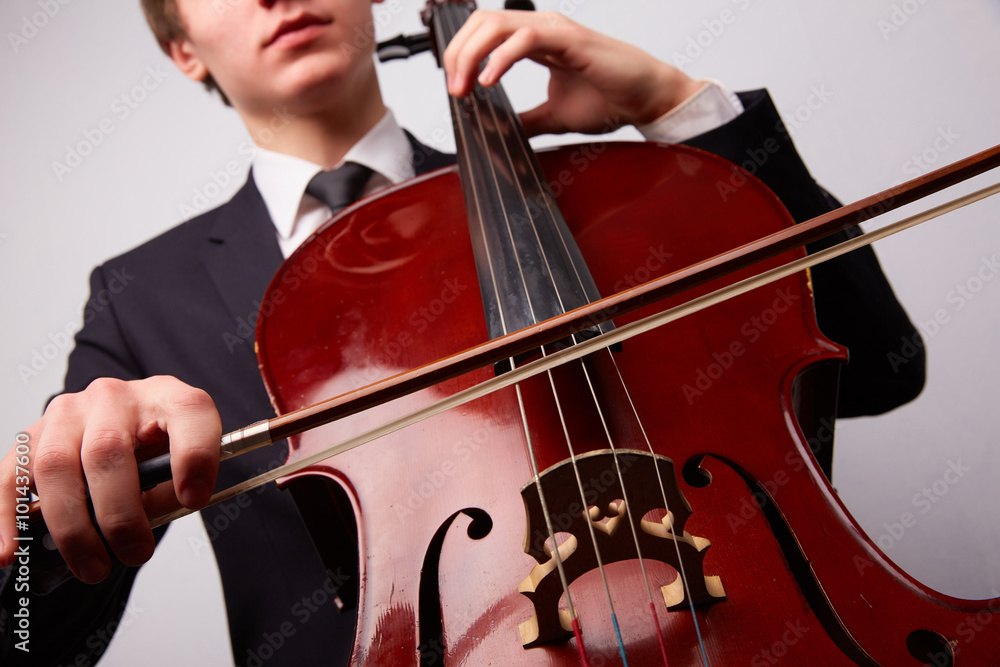 Fototapeta premium young man with a cello