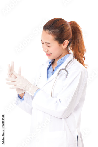 portrait of female doctor putting gloves