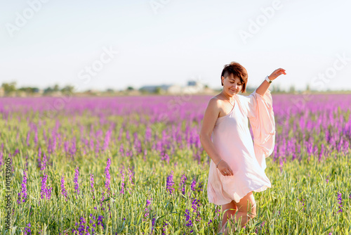 Fototapeta Naklejka Na Ścianę i Meble -  woman on flower field