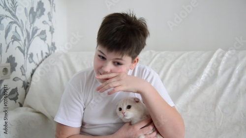 Teenager with an allergy to cats scratching  nose