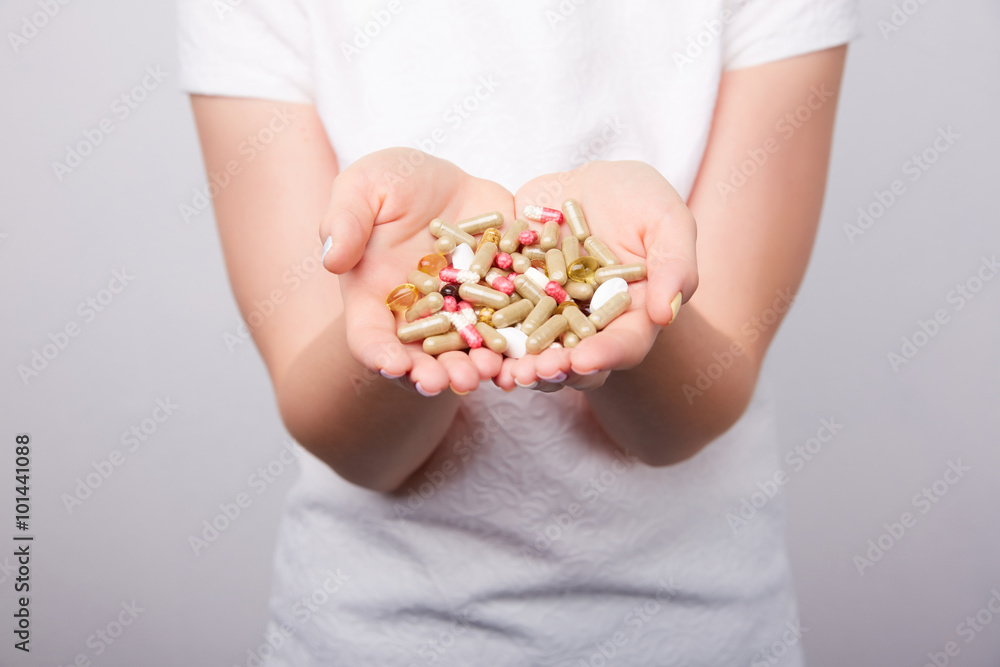 many pills and capsules in women in the hands many pills and capsules in women in the hands