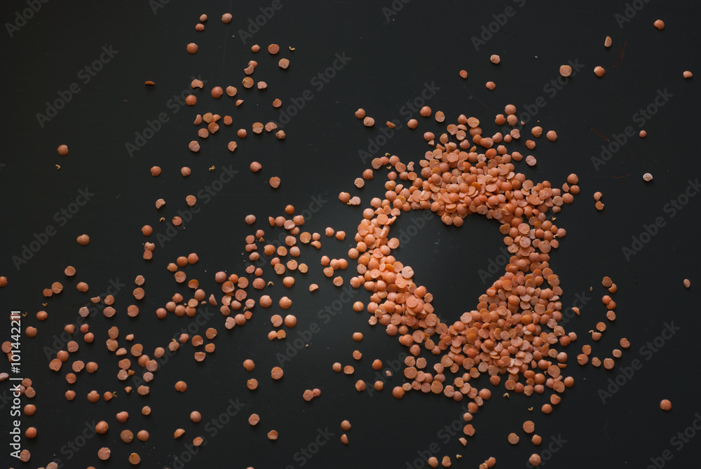 red lentil heart on dark wooden table