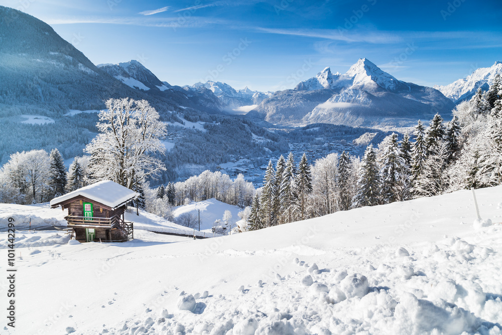 Winter wonderland in the Alps with mountain chalet
