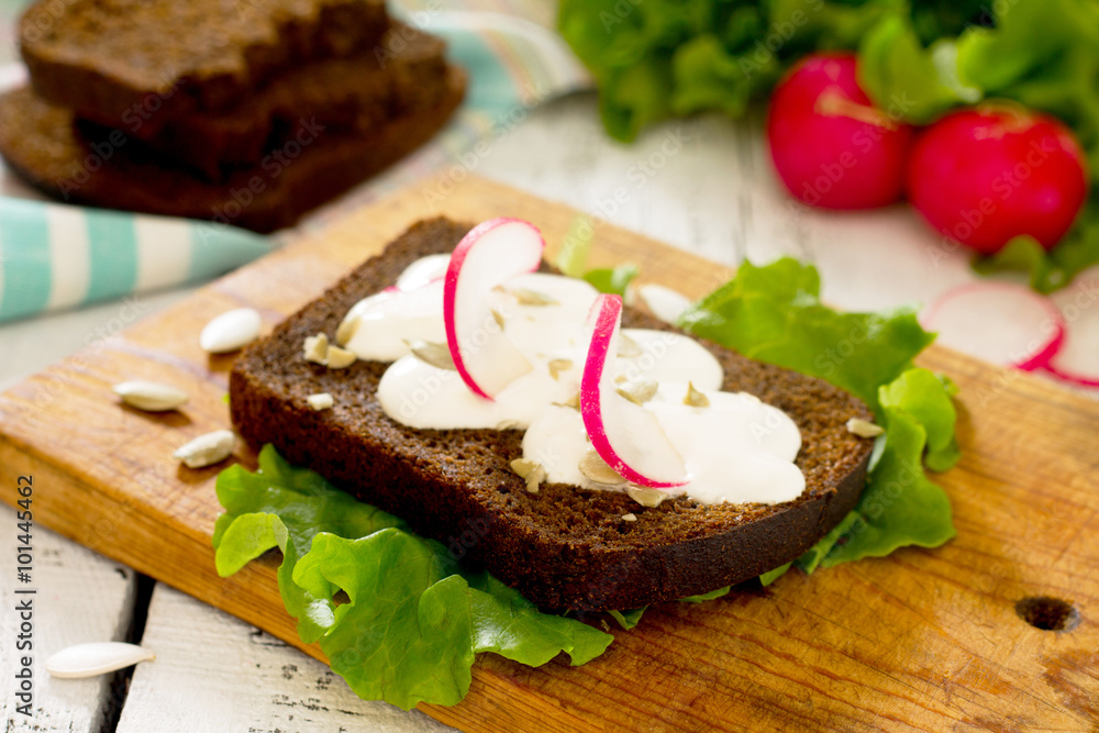 Fresh toast sandwich with egg, radish, pumpkin seeds and sour cr Fresh toast sandwich with egg, radish, pumpkin seeds and sour cr