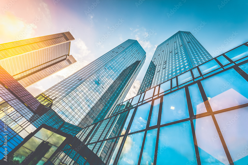 Modern skyscrapers in business district at sunset