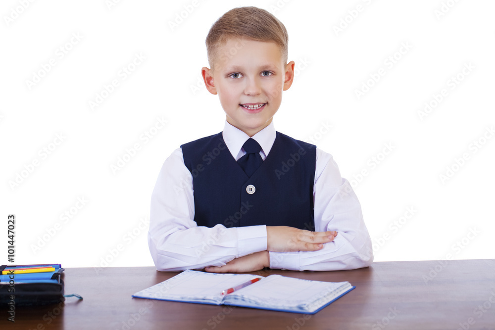 Caucasian school boy at his desk on white background with copy s Caucasian school boy at his desk on white background with copy s