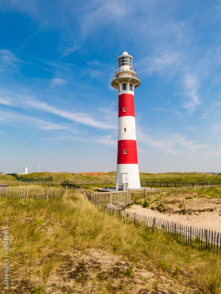 Lighthouse on the coast of the North Sea in a sunny day, Belgium Lighthouse on the coast of the North Sea in a sunny day, Belgium