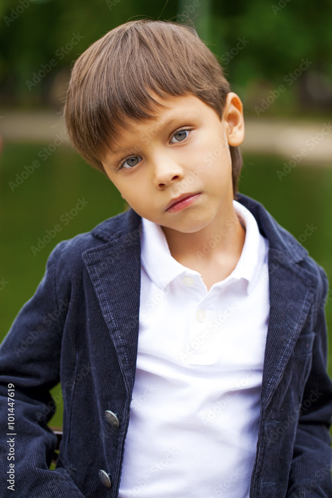 Fashionable little boy outdoor at the nice summer day Fashionable little boy outdoor at the nice summer day
