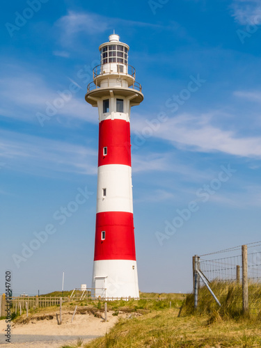 Lighthouse on the coast of the North Sea in a sunny day  Belgium