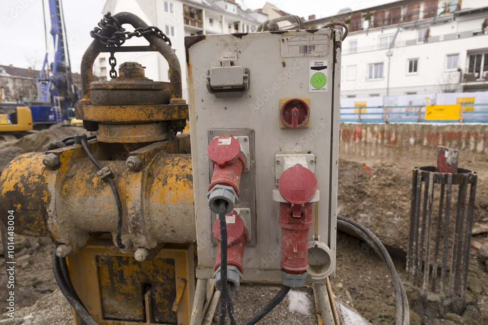 An electrical switch cabinet on a construction site with some construction