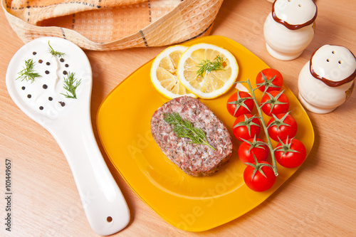 cutlet on a plate with cherry tomatoes