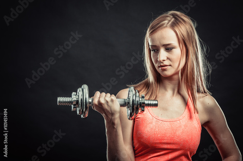 Fitness sporty girl lifting weights
