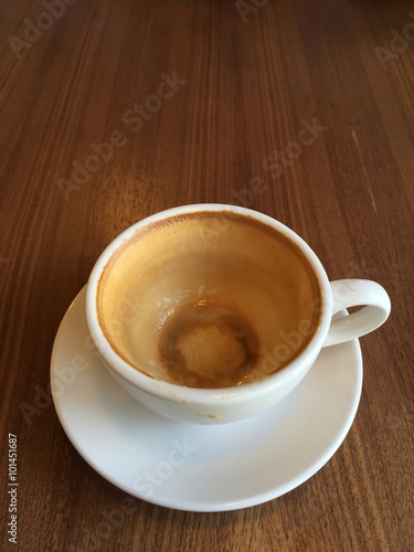 Empty coffee cup on wood table at coffee shop