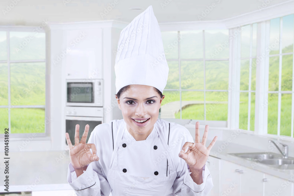 Fotografie Cheerful chef showing OK sign