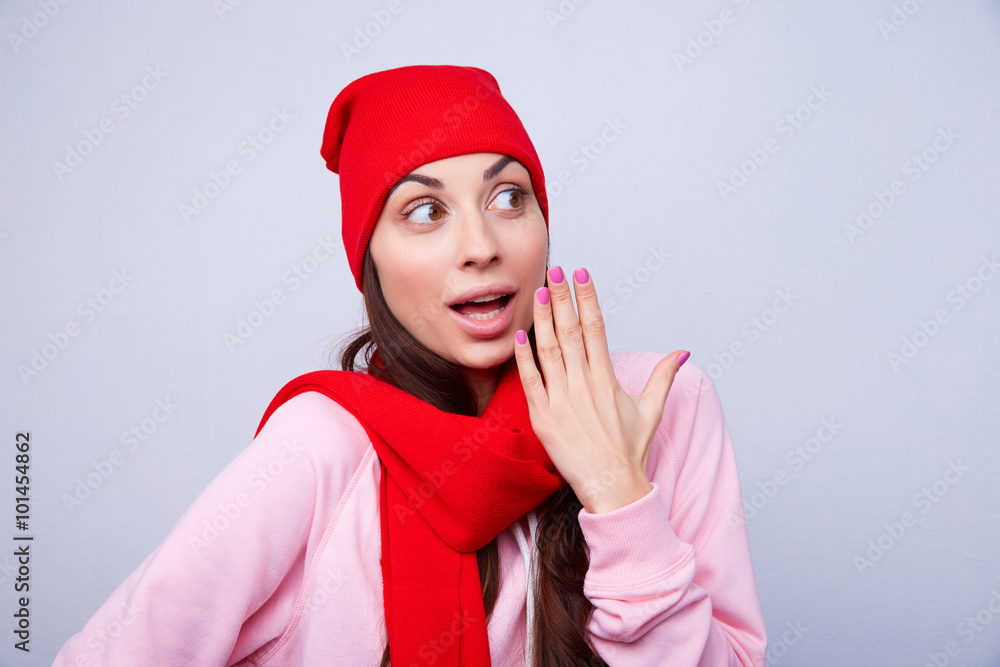 girl in a red hat and scarf surprised girl in a red hat and scarf surprised