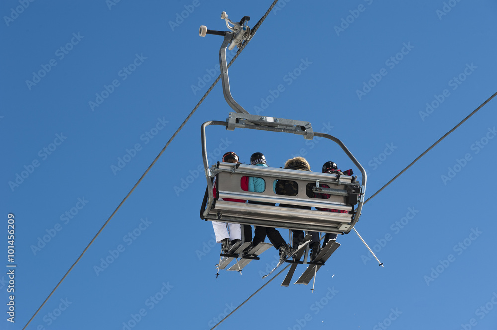 Chairlift full of skiers at a ski resort