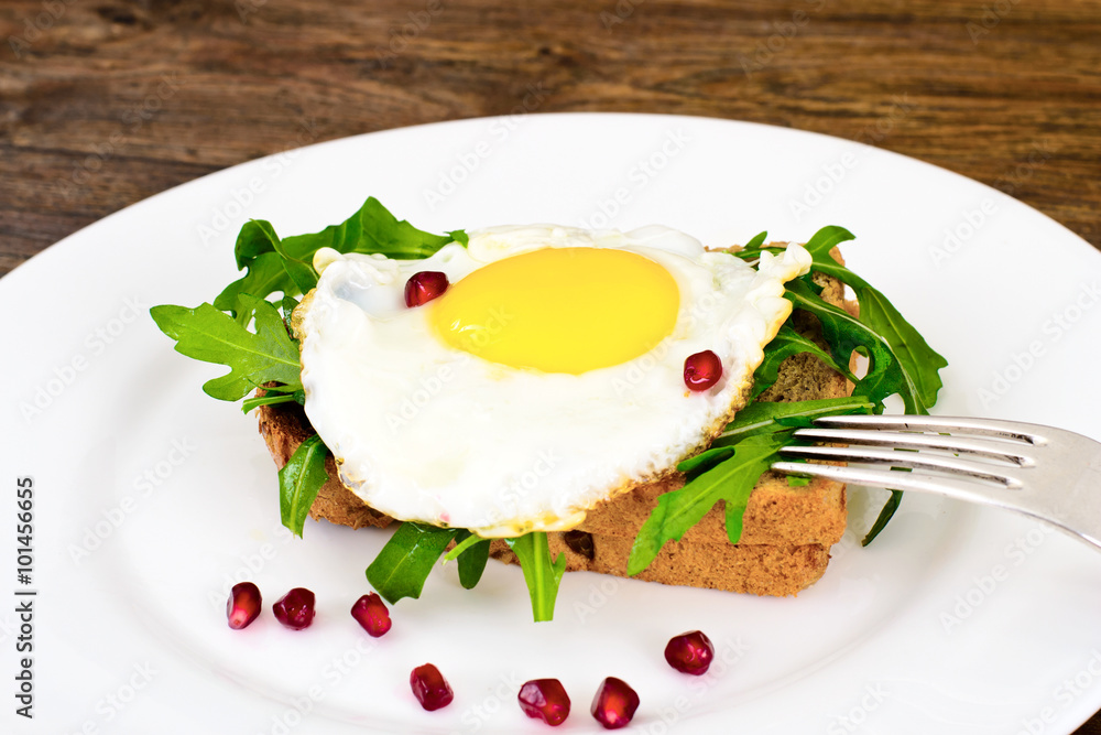 Scrambled Eggs with Arugula on Whole Grain Bread Scrambled Eggs with Arugula on Whole Grain Bread