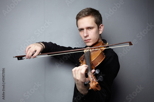 man playing violin close-up