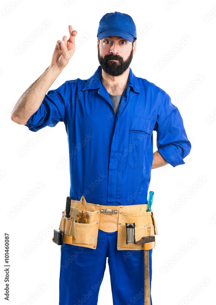 Plumber with his fingers crossing